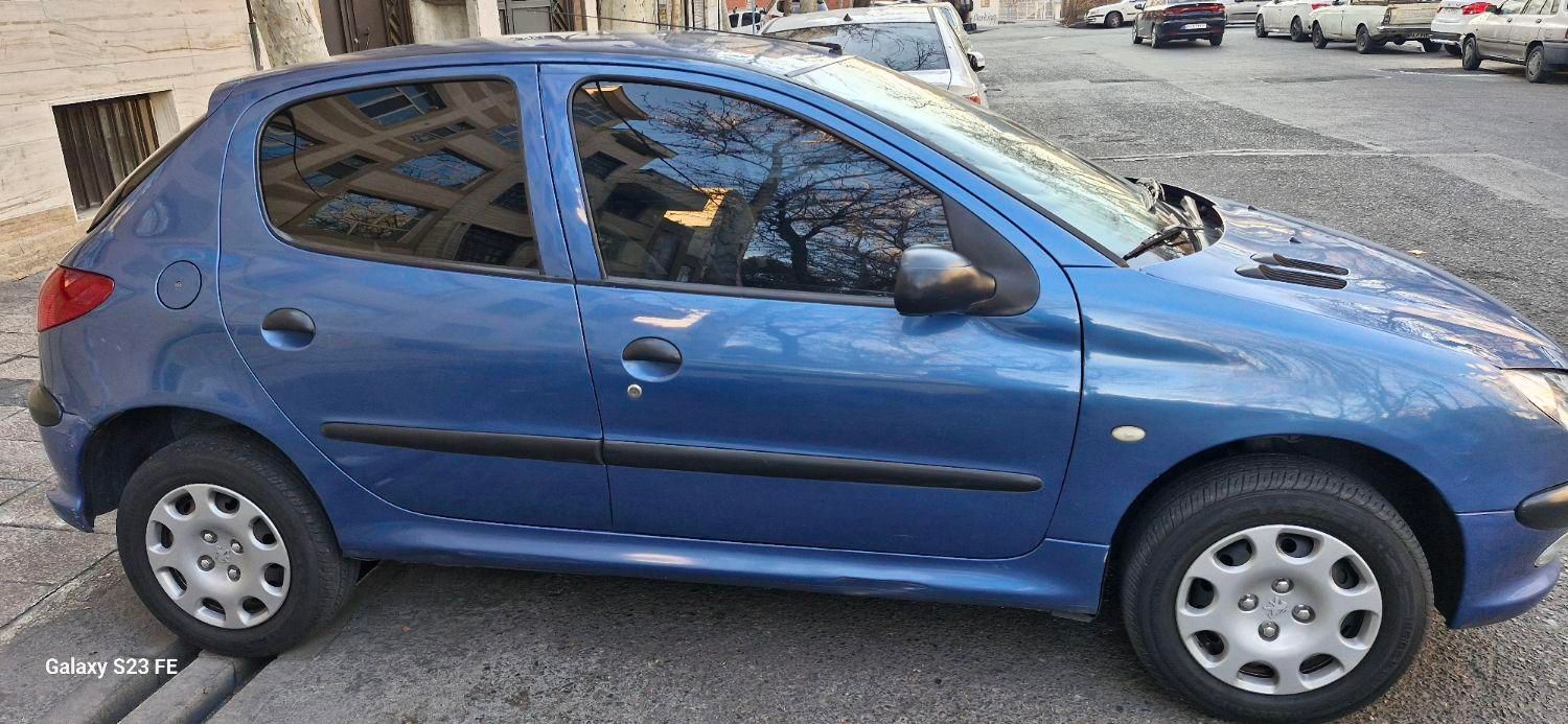 پژو ۲۰۶ تیپ پنج مدل ۱۳۹۰ رنگ آبی متالیک|خودرو سواری و وانت|تهران, تسلیحات|دیوار