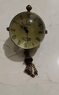 ساعت قدیمی امگا کروی کوکی