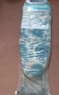 میز اتو صندلی گردون ساعت دیواری و شیرینی خوری