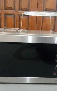 مایروفر الی جی مدل MH8265CIS اکبندLG