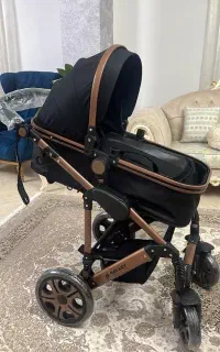 کالسکه به همراه کریر قابل نصب روی کالسکه