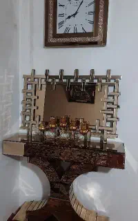 اینه شمعدان با ساعت دیواری