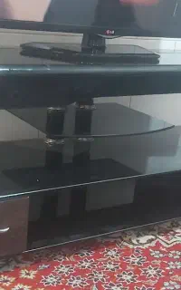زیر تلویزیونی شیشه ای