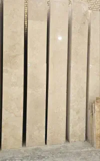 سنگ از درب مجموعه کرم عسلی تراورتن به محل شما
