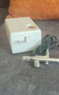 یک عدد دستگاه ایربراش و سوهان برقی