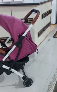 کالسکه نوزاد خارجی تاشو آلومینیومی دسته چرم