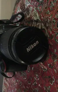 دوربین نیکون D7100 به همراه سه پایه