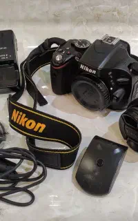 دوربین عکاسی نیکون D5100 زیر قیمت باتمام لوازم