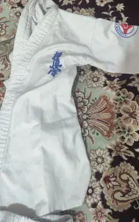 فروش لباس کاراته همراه با کمربند سبز