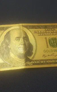 یک عددپول دلار با روکش طلا ومرواید اصلی