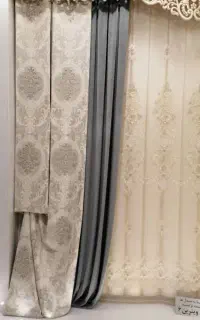 حراج مقداری پرده دوخته شده به علت جمع کردن مغازه