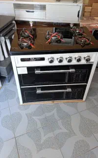 اجاق گاز طرح فر  صفحه شیشه ای نو آکبند