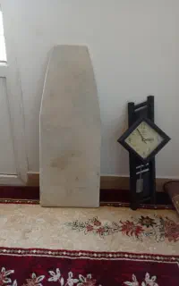زیر اتو همراه یک عدد ساعت