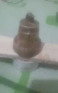 یک زنگوله یک  ترازوی قدیمی ویک کوری برنجی قدیمی