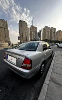 مزدا 323 FL نقره ای