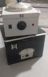 یک عدد دستگاه شمع و وکس