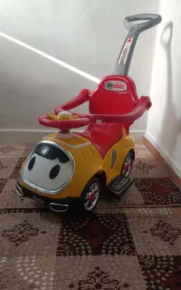 ماشین چهار چرخ دسته دار