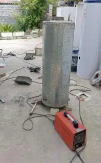 جوشکاری آبگرمکن و تعمیر آبگرمکن  درب منزل