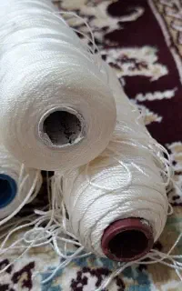 دکمه و نخ قیطون