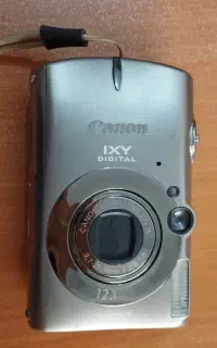 دوربین عکاسی مارک Canon ژاپنی با سه پایه عکاسی