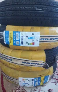 لاستیک دورسفید خارجی وچهارعدد قالپاق دوج سایز 14