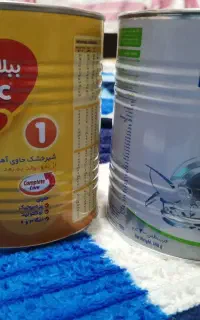 قوطی با پیمانه شیر خشک