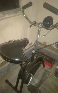 اگهی فروش دوچرخه ثابت .چرخونک و دمبل