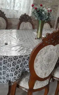 میز نهارخوری با ۸ عدد صندلی عدد مبل راحتی تک نفره