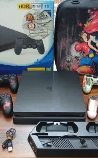PS4 Slim 1TBفول پک و 4 دسته و کیف حمل و بازی