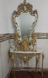 آینه به همراه کنسول وساعت وشمعدانی