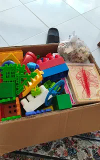 فروش ی جعبه اسباب بازی به همراه یک پازل کتابی