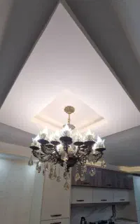 لوستر برنزی 10 شعله و فرش نقش برجسته