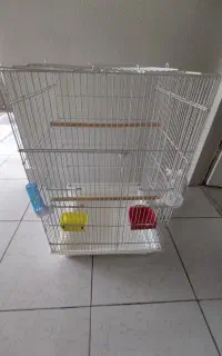 قفس پرنده همراه با وسایل