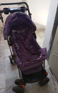 کالسکه بچه رنگ بنفش