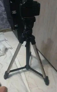 دوربین و سه پایه دوربین مدل کنون
