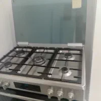 اجاق گاز و جارو برقی