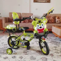 دوچرخه کاملا نو و عروسک