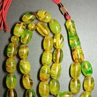 چهار عدد تسبیح کهربا بودار شیشه‌ای