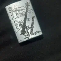 دوعدد دستبندتمام استیل رنگ ثابت وفندک طرح زیپوگازی