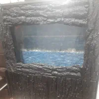 آکواریوم بادکورپوست درخت.داخلش صخره سطبقه کارشده