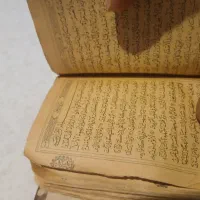 قرآن عتیقه قدیمی با روکش چرم