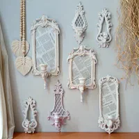 انواع دیوارکوب دیواری با کاربرد قاب عکس و شمعدان