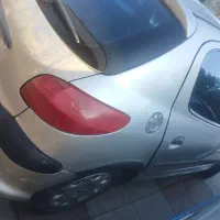 پژو 206نقرهای شاسی پلمپ دوررنگ150میلیونش اقساط