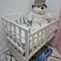تخت نوزادی کنار مادر