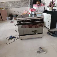 اجاق گاز تمام استیل سینجر فر دار میباشد