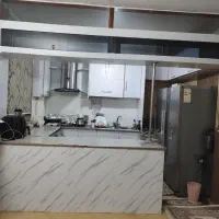 کابینت کار کرده همراه گاز رومیزی و هود و سینک