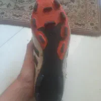 یک جفت کتانی دو جفت استوک فوتبال