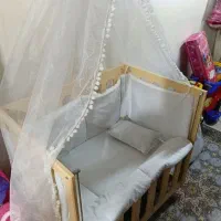 گهواره کنار مادر