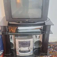 تلوزیون  میز تلوزیون شیشه ای و ظبط و باند