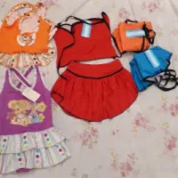 تعدادی لباس شنا و جوراب دخترانه